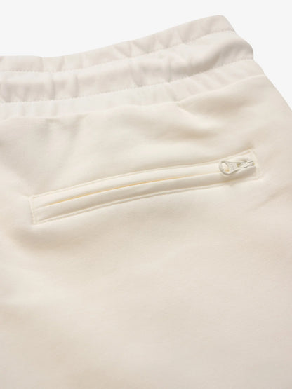 Dettaglio logo Blauer dorato su pantalone felpa