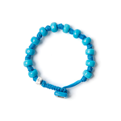 Braccialetto Aua Cielo unisex in vetro azzurro con cordoncino cerato e dado in argento 925 fronte