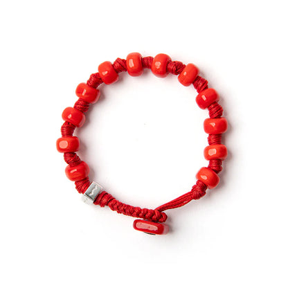 Braccialetto Aua Papavero unisex con cordoncino rosso e vetro lavorato a lume, con dettaglio in argento 925 fronte